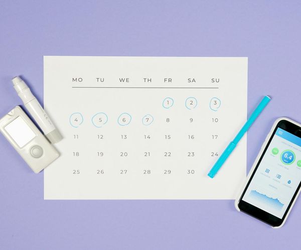 A calendar with circled dates representing a consistent habit.